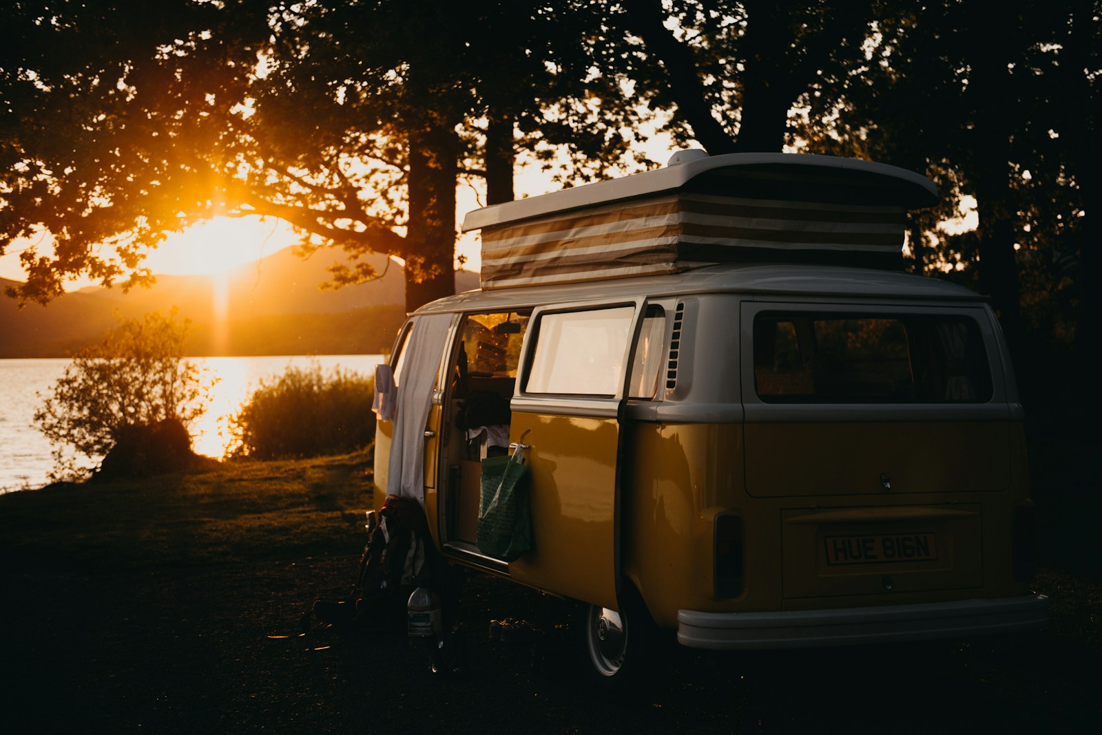 brown van under the tree during sunset, recreational vehicle